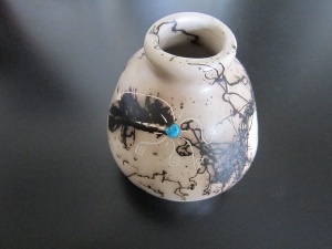 Navajo horsehair pottery, hand-made, hand-painted and adorned with turquoise.