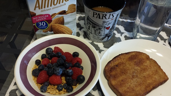 Granola with a generous topping of fresh berries and almond milk, and whole wheat toast - and Sumatra coffee, of course (my favorite)!